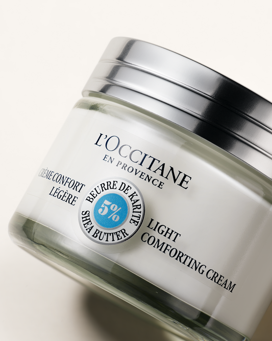 L'Occitane light comforting cream jar on a white background
