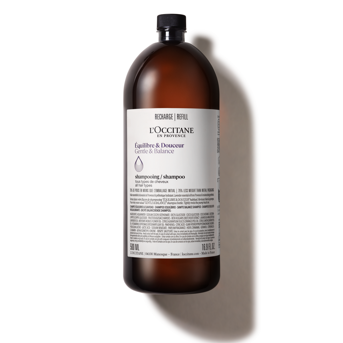 A bottle of l ' occitane liquid on a white background
