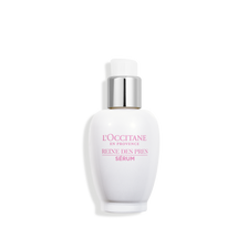 A bottle of lotion on a black background