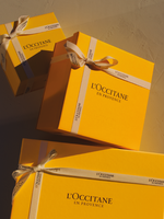 Three yellow boxes with a white ribbon tied to them - Illustration 1