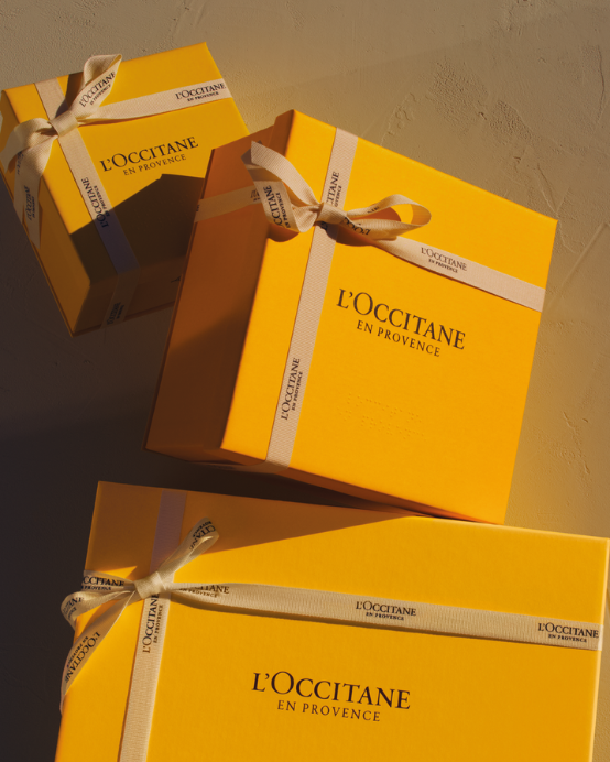 Three yellow boxes with a white ribbon tied to them - Illustration 1