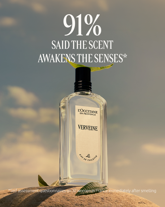 L'Occitane Verveine perfume bottle with a nature-themed background